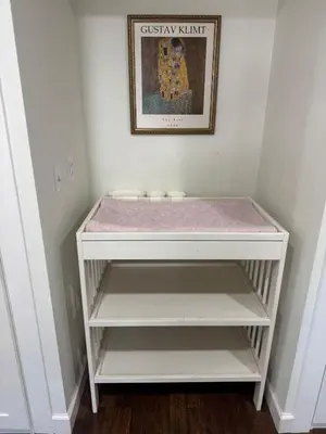 a white shelf with a pink blanket on it at Family Fun 3-bedroom house with gym, games, toys, outdoor hangout and coffee in Orlando