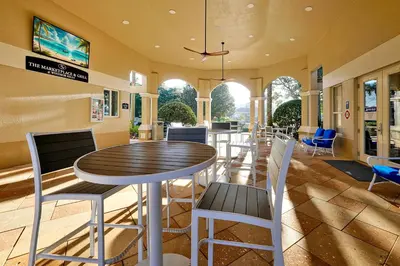 a dining room with a table and chairs at Whimsical Mouse Manor in Orlando