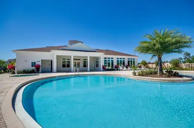 a large swimming pool in front of a house at Your Disney Vacation Home WL8932 in Kissimmee