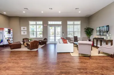 a living room with a couch and chairs at Your Disney Vacation Home WL8932 in Kissimmee