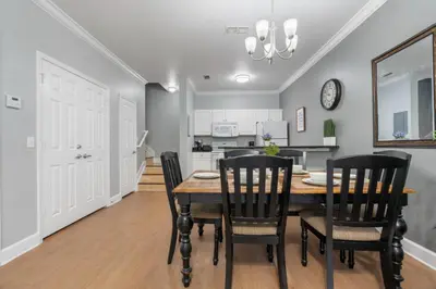 a kitchen and dining room with a table and chairs at Your Disney Vacation Home 7102 in Kissimmee