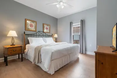 a bedroom with a large white bed and a window at Your Disney Vacation Home 7102 in Kissimmee