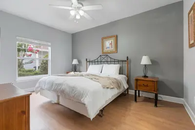a bedroom with a bed and a ceiling fan at Your Disney Vacation Home 7102 in Kissimmee