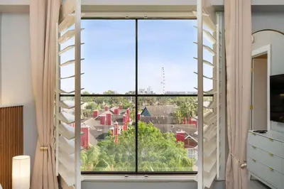 a room with a large window with a ladder at Orlando 2BR Apt Full Kitchen Near Parks in Orlando