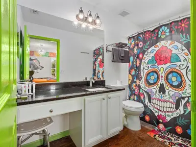 a bathroom with a skull patterned shower curtain at bsv_villa8513 in Kissimmee