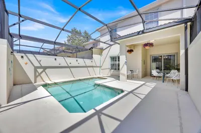 an indoor pool in a house with glass ceilings at Disney Themed Home l Private Pool l Lazy River in Kissimmee