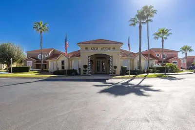 a building with a sign for a club house at Kissimmee Vacation Beautiful Home in Kissimmee