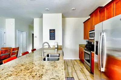 a kitchen with a sink and a counter top at Bright Cheery Vacation Villa-1638St in Kissimmee