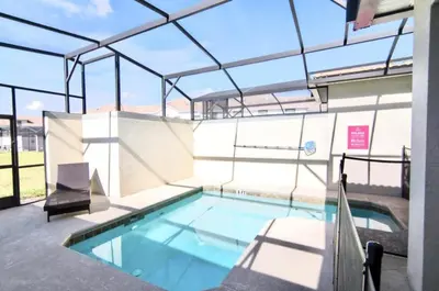 an indoor swimming pool with a glass roof at Family Retreat W-Splashpool-1637St in Kissimmee