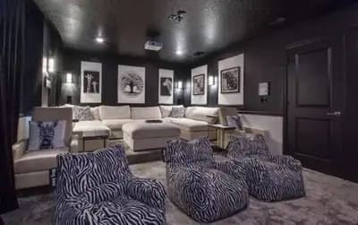 a living room with a zebra print couch and chairs at Beautiful Brand New Waterfront Retreat!1689St in Kissimmee