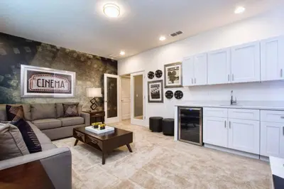 a kitchen and living room with a couch and a table at Sonoma - 6 Bedroom Pool Home- 1859Snr in Kissimmee