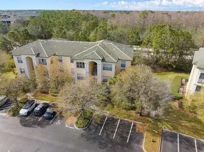 an overhead view of a house with cars parked in a parking lot at Harry's Hangout at Legacy Dunes - Sage Vacations in Kissimmee