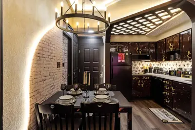 a dining room with a table and a chandelier at Apartment w 4 Beds Near I-Drive in Orlando