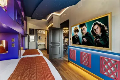 a bedroom with a movie poster on the wall at Apartment w 4 Beds Near I-Drive in Orlando