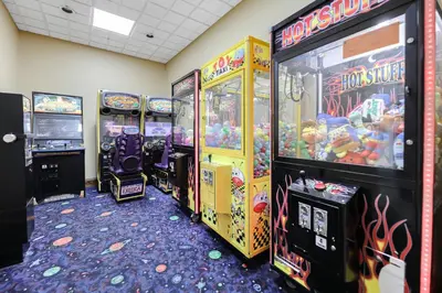 a row of arcade games in a room at Apartment w 4 Beds Near I-Drive in Orlando