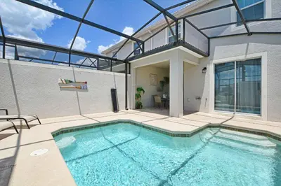 a swimming pool in a house with a building at Modern Decor, Waterview With Splashpool, Bbq 1636Str in Kissimmee