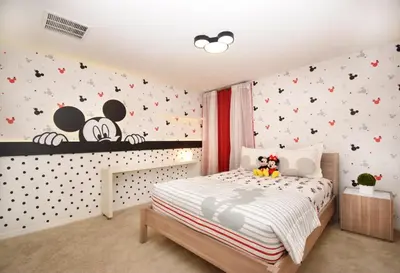 a bedroom with a bed with hello kitty stickers on the wall at Family Friendly Home W Game Room 1705Vp in Kissimmee