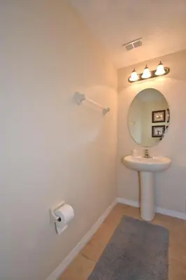 a bathroom with a sink and a mirror at Family Friendly Home W Game Room 1705Vp in Kissimmee