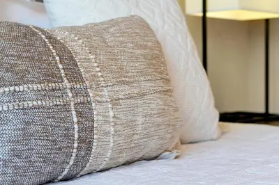 a close up of a pillow on a bed at Magic Village Resort 5 Minutes to Disney!! in Orlando