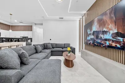 a living room with a couch and a fireplace at Cozy Apartment 03 Bedrooms at Storey Lake Resort in Kissimmee