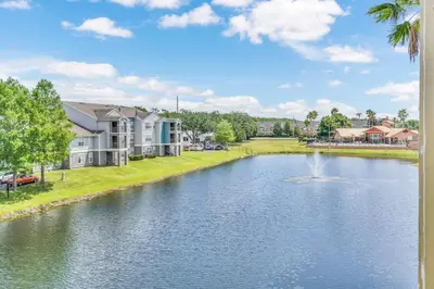 a view of a pond with a fountain at Elegant and cozy 2 BD condo near Disney in Kissimmee