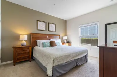 a bedroom with a large bed and a window at Outstanding 4 bdr near Disney 16108 in Kissimmee