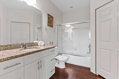 a bathroom with a sink and a toilet and a shower at New 4BDR House near Disney 8979 in Kissimmee