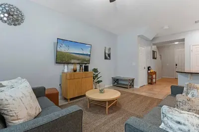 a living room with two couches and a tv at Family House near Disney - 5109 in Kissimmee