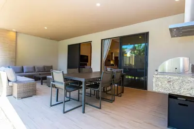 a dining room with a table and chairs at Luxury 3BDR House near Disney 7527 in Orlando