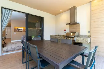 a dining room with a wooden table and chairs at Luxury 3BDR House near Disney 7527 in Orlando