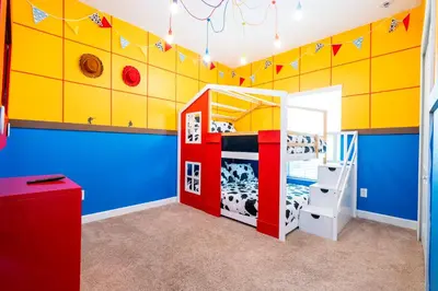 a childs bedroom with a cow bunk bed at Paradise renovated 5 BD walk to clubhouse 8935 in Kissimmee