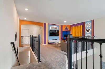 a hallway with a room with a train painted on the wall at Family 5BR Retreat w Pool Near Disney in Kissimmee