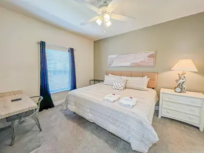 a bedroom with a bed and a ceiling fan at Perfect vacation spot near Disney 7105 in Kissimmee