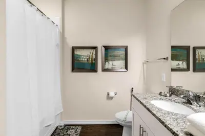 a white bathroom with a sink and a toilet at Your Home near Disney 19106 in Kissimmee
