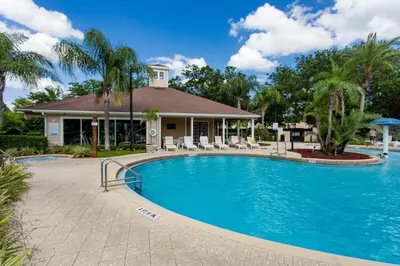 a swimming pool in front of a house at Your Home near Disney 19106 in Kissimmee