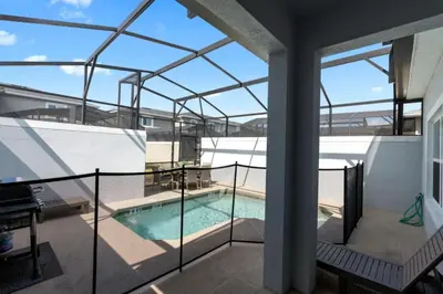 a view of a swimming pool from the balcony of a house at Outstanding 5BDR Disney Vacation in Kissimmee
