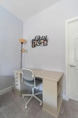 an office with a desk with a chair and a lamp at Home Away from Home in Disney 4106 in Kissimmee