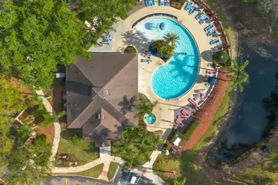 an overhead view of a pool at a resort at Home Away from Home in Disney 4106 in Kissimmee