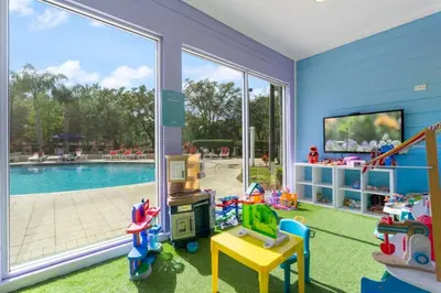 a childs play room with a pool and a large window at Home Away from Home in Disney 4106 in Kissimmee