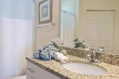 a bathroom with a sink and a mirror at Amazing 4bdr house in Disney 20104 in Kissimmee