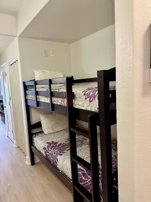 a group of bunk beds in a room at Beautiful Orlando Lakefront Condo 5 MINUTES FROM DISNEY in Orlando