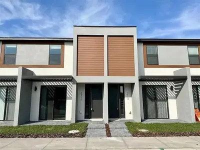 a large house with brown and white at 3417 Brand New 3BD Family Home Near Disney in Kissimmee
