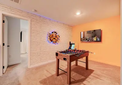 a room with a table with wine bottles on it at 3417 Brand New 3BD Family Home Near Disney in Kissimmee
