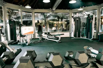 a gym with several treadmills and exercise equipment at Luxury and Cozy Gem 15min to Disney Free Parking in Kissimmee