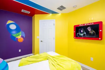 a childs bedroom with colorful walls and a tv at Gorgeous 4Bd w Pool at Encantada Resort 8523 in Kissimmee