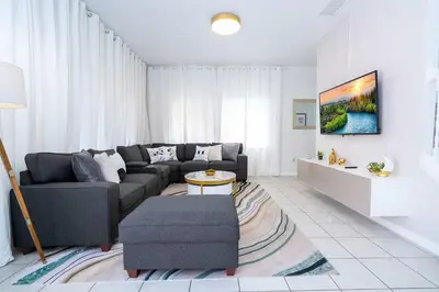 a living room with a couch and a table at Gorgeous 4Bd w Pool at Encantada Resort 8523 in Kissimmee
