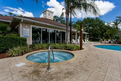 a swimming pool in front of a house at Amazing 3Bdr House near Disney 16106 in Kissimmee