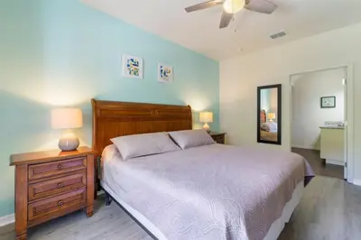 a bedroom with a bed and a ceiling fan at Amazing 3BDR House near Disney 12102 in Kissimmee