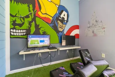 a room with a desk with a computer and a mural at Amazing 3BDR House near Disney 12102 in Kissimmee