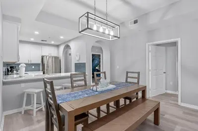 a dining room and kitchen with a table and chairs at Finding Nemo House at Caribe Cove Resort - Sage Vacations in Kissimmee